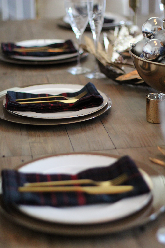 Table setting ideas. Gold flatware. plaid napkins. gold chargers. rustic table. gold accents