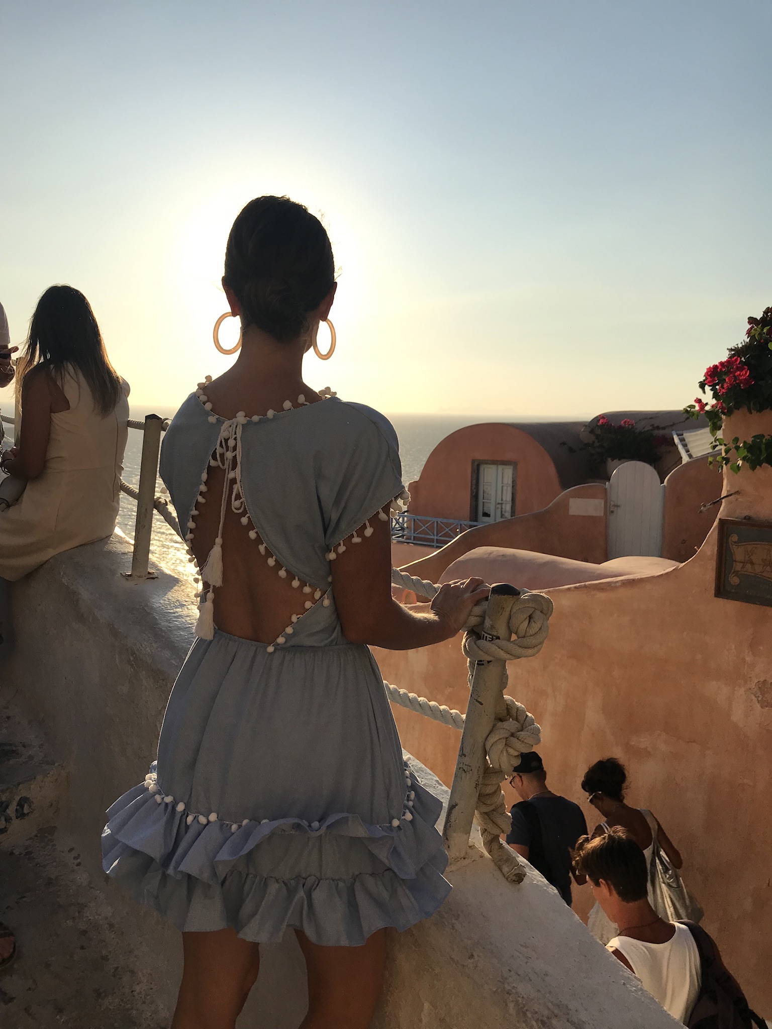 Streets of Oia Greece. what to wear on vacation in Santorini greece. Oia Sunset