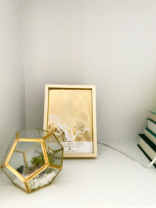 Bookshelf styling, gold accents