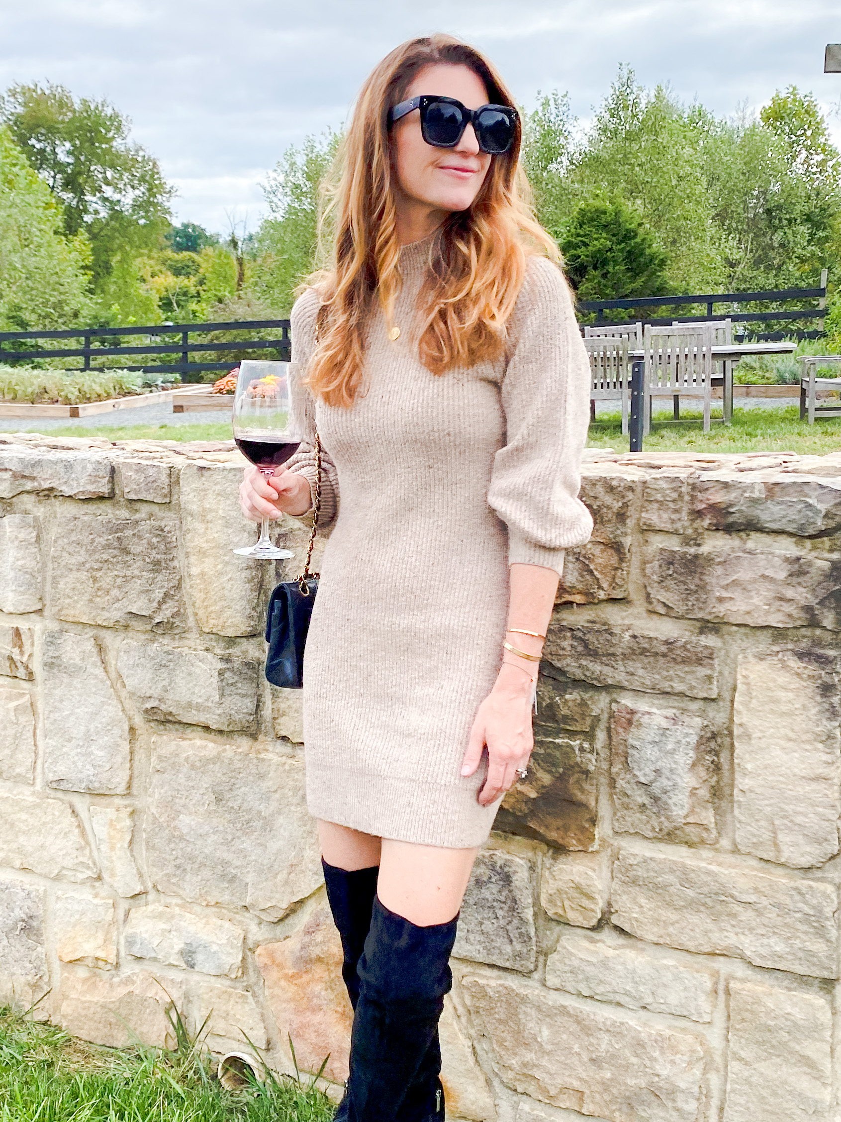 Fall sweater dress outfits. Sweater dress and black high knee boots, salamander resort and spa, fall outfit ideas, fall dress ideas, finding beauty mom outfit ideas for fall and thanksgiving, what to wear to a wine vineyard 