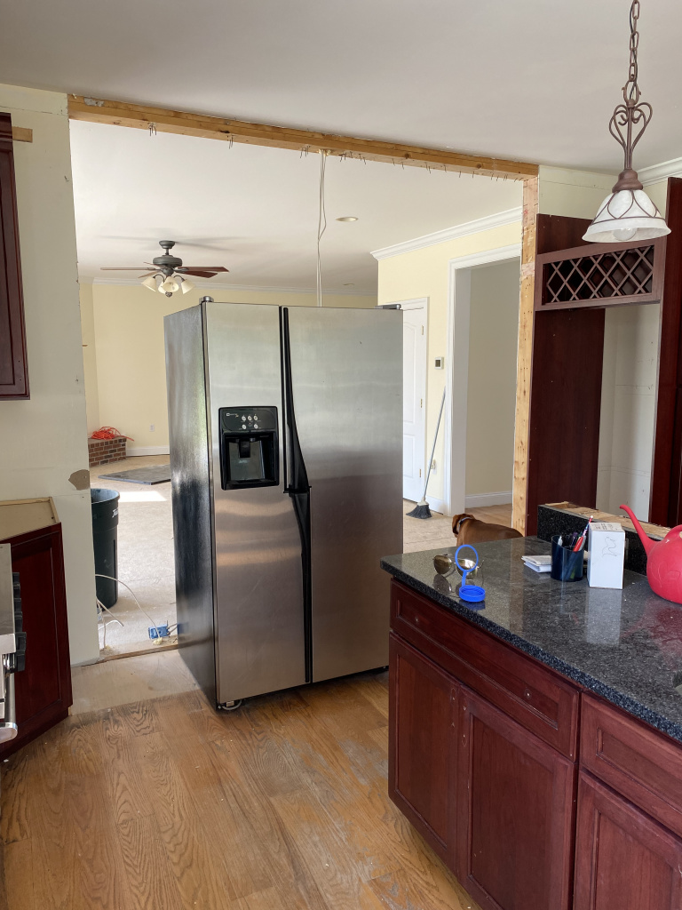 kitchen renovations, kitchen updates, modern kitchn updates, vacation home kitchen projects, dark cabinets to light, white and blue kitchen updates, fridge in kitchen
