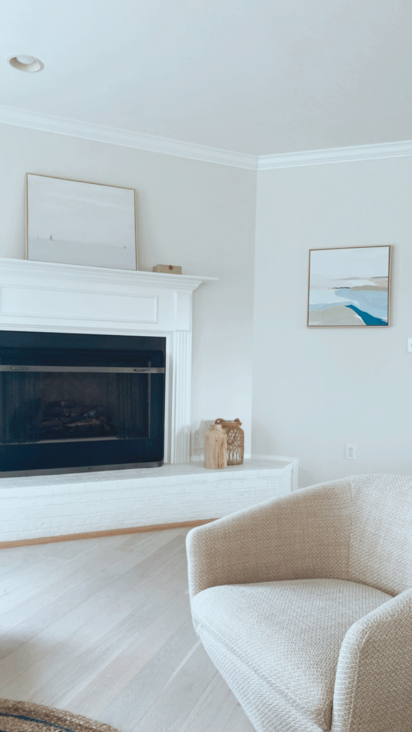 Coastal living room with fireplace, coastal decor accessories, pottery barn furniture, blue aesthetic home 