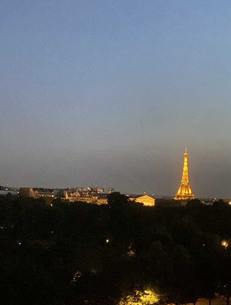 Eiffel Tower at night, view from the Hotel Brighton in Paris France