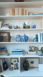 Nancy Meyers Home Aesthetic styling a book shelf with ginger jars getting that old money home vibe